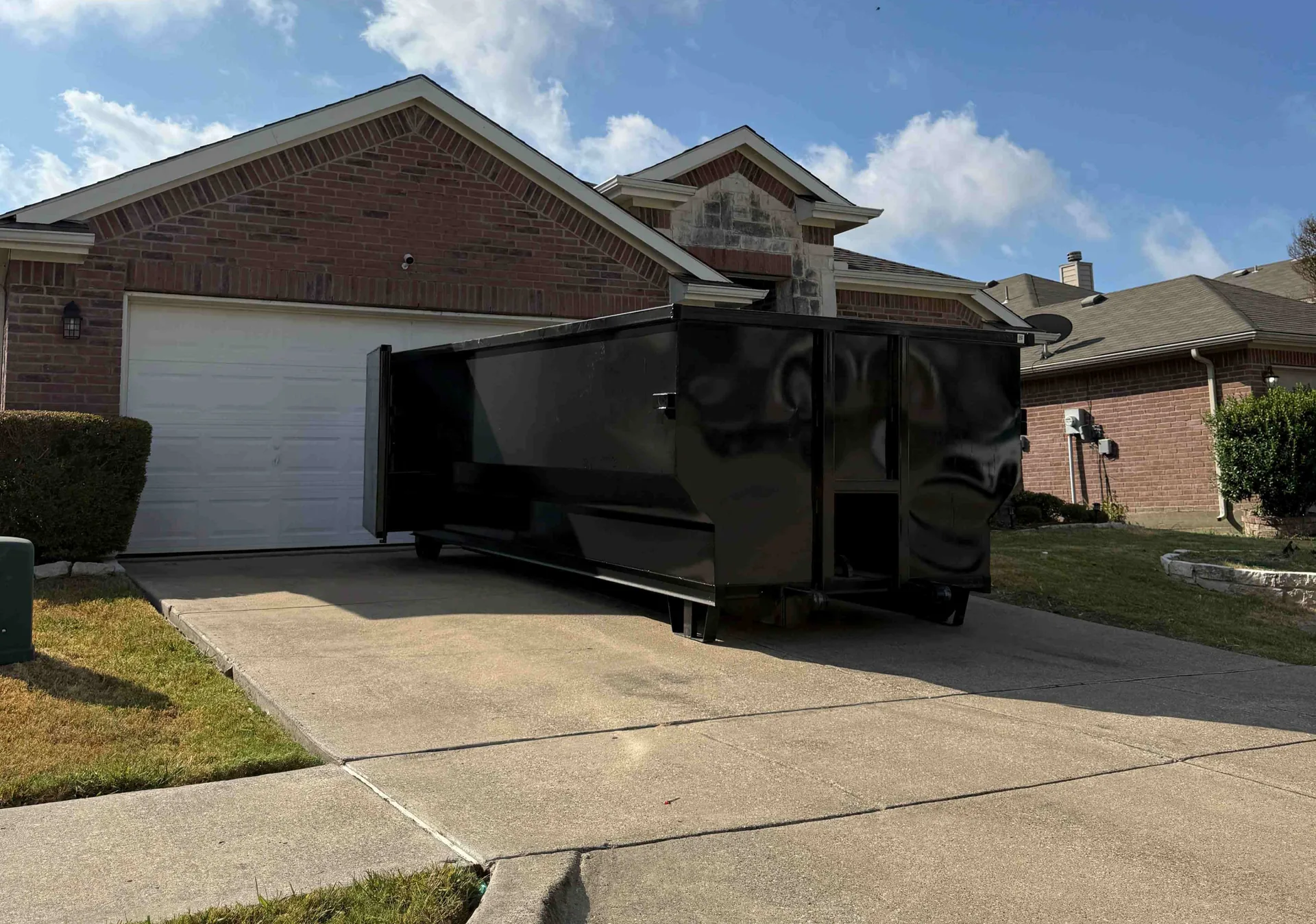 30-yard Nortex dumpster on a residential driveway