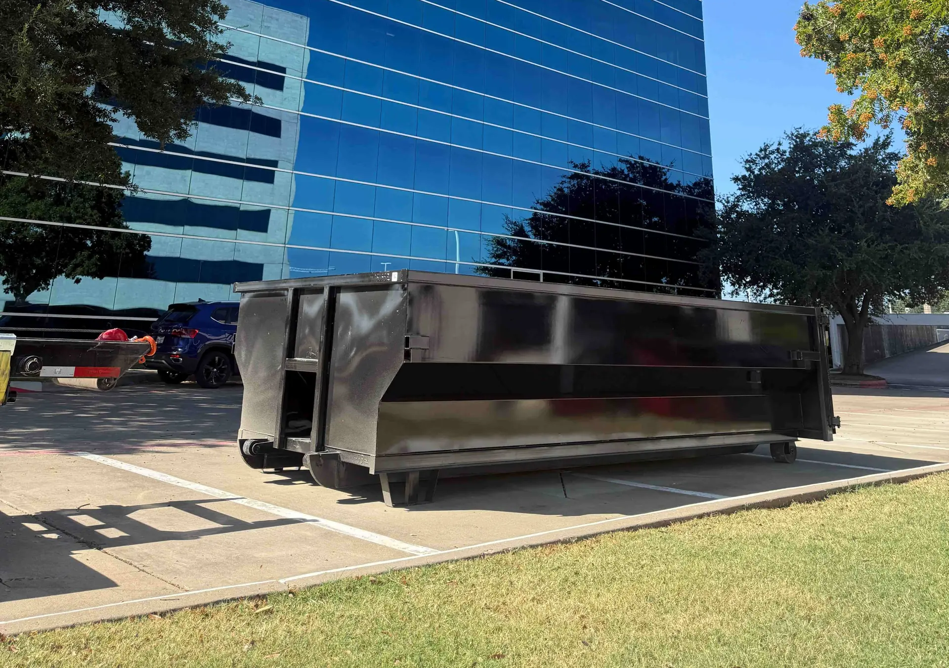 Nortex dumpster placed beside an office building